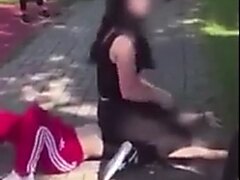 Woman Sits On Opponents Face During A Street Fight