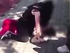 Woman Sits On Opponents Face During A Street Fight