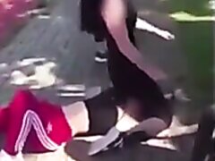 Woman Sits On Opponents Face During A Street Fight